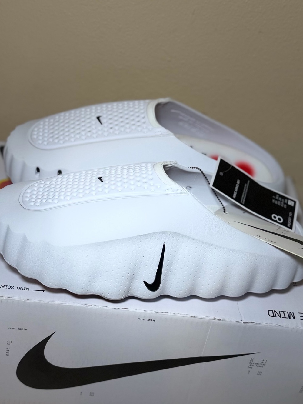 Nike Kids White Slip-On Slide with Black Swoosh Accent
